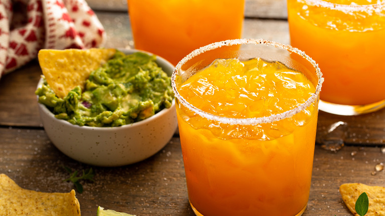 guacamole and orange drinks