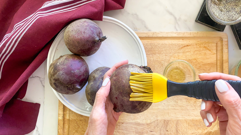 Brushing beets with oil