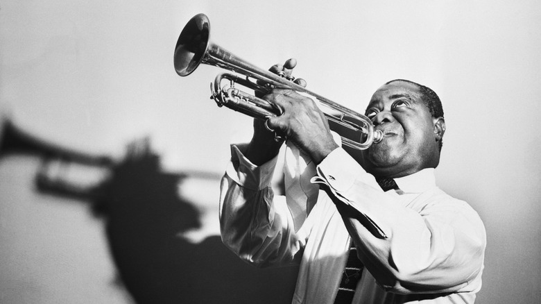 Louis Armstrong playing trumpet