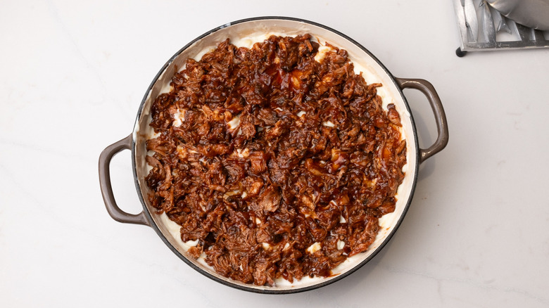 Pulled pork over unbaked mac and cheese