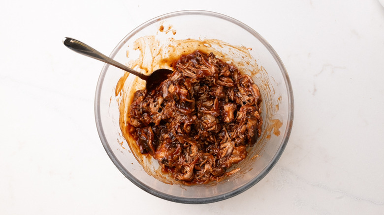 BBQ pulled pork in glass bowl with fork