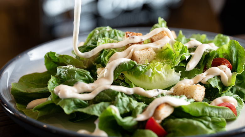 Salad dressing drizzled over produce