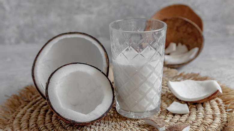 Coconuts and glass of coconut milk