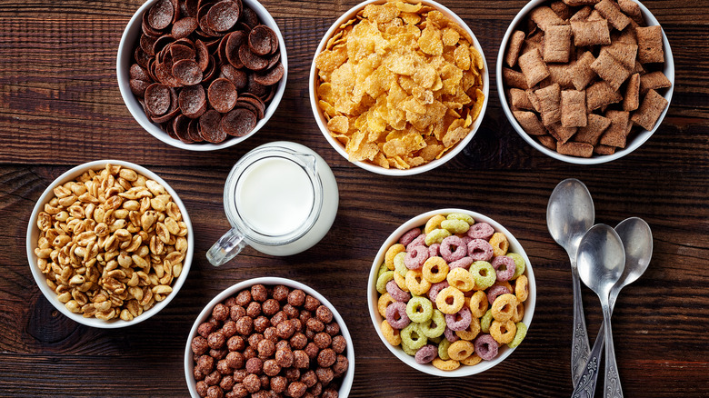 Bowls of different cereal and milk