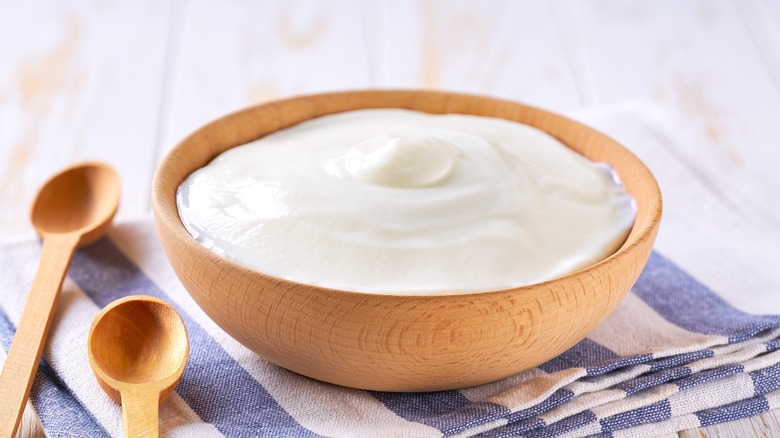 bowl of yogurt with spoon and napkin