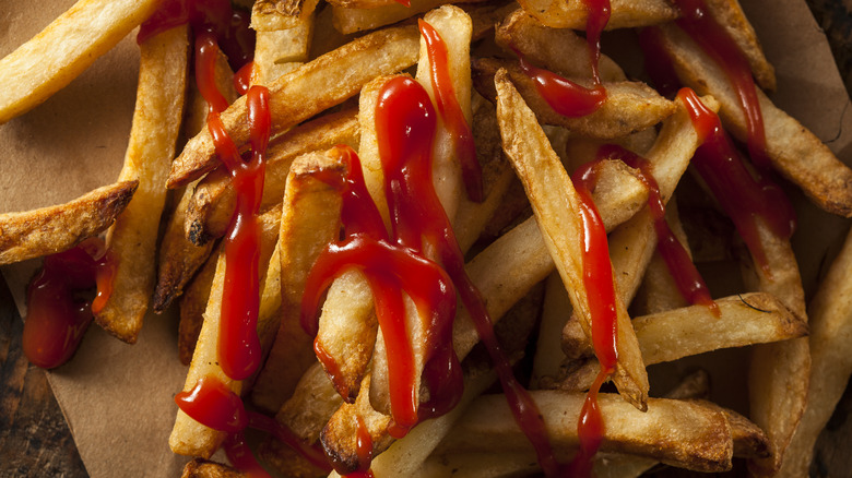 french fries covered in ketchup