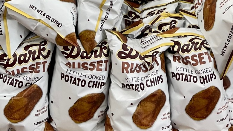 Bags of dark russet chips