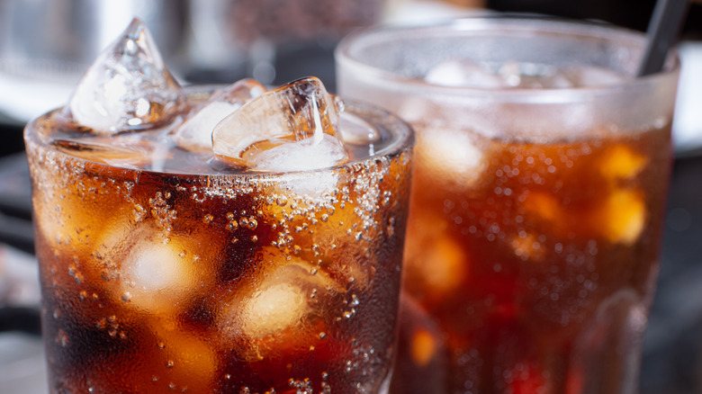 dark-colored soda with ice