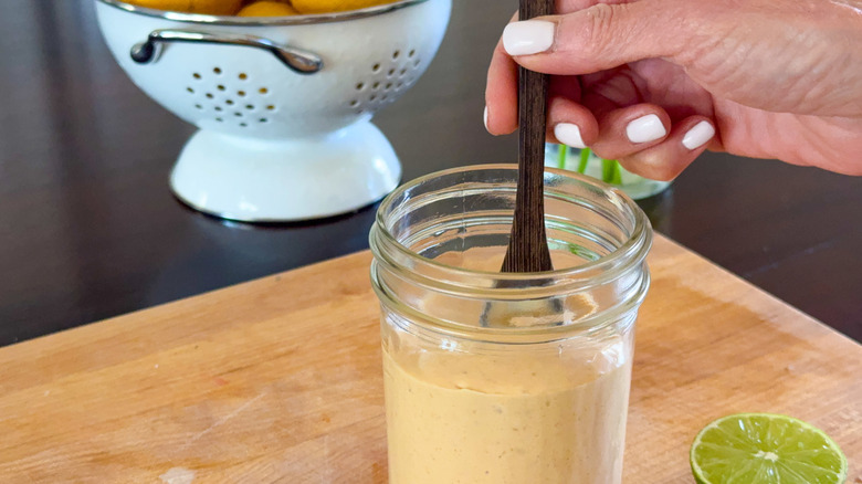 hand stirring sauce