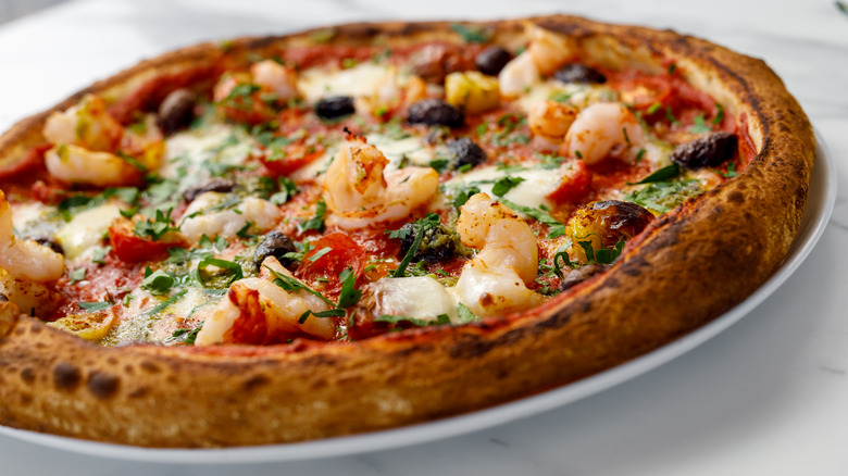 Full pie of pizza with shrimp