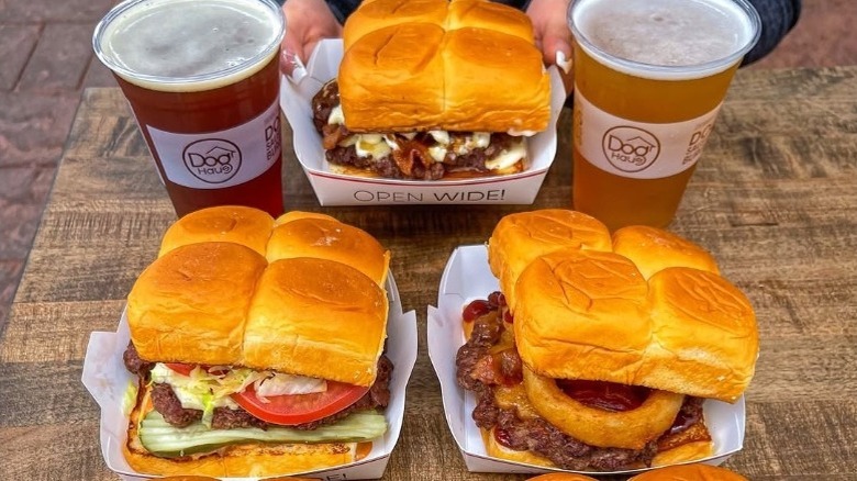 Dog Haus burgers on an outdoor table