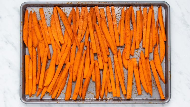 sweet potatoes on baking sheet 