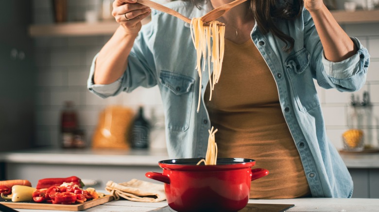 woman making pasta at home