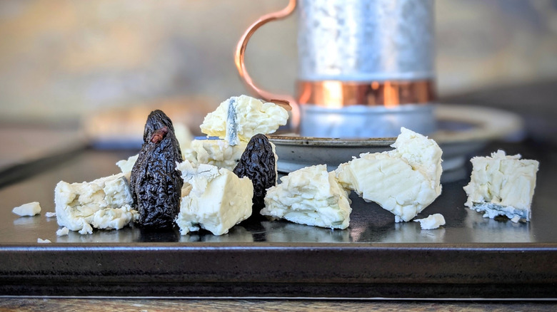 crumbled blue cheese and dried figs with pottery