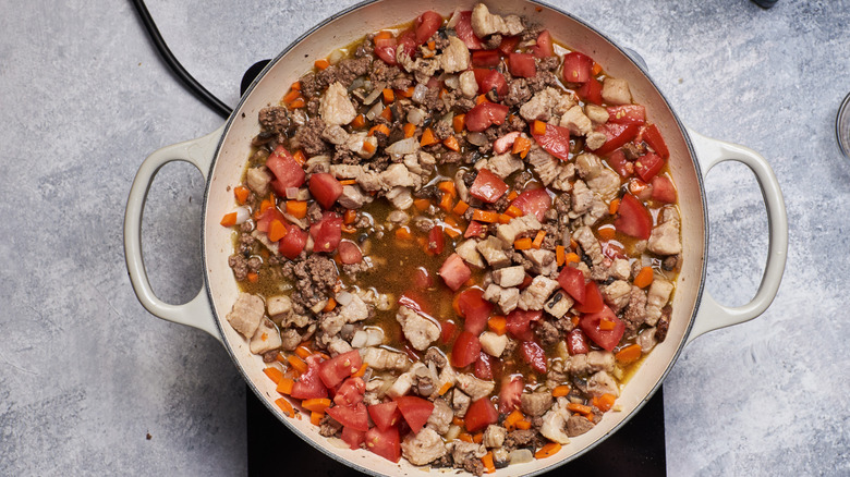 beef and tomatoes in pot