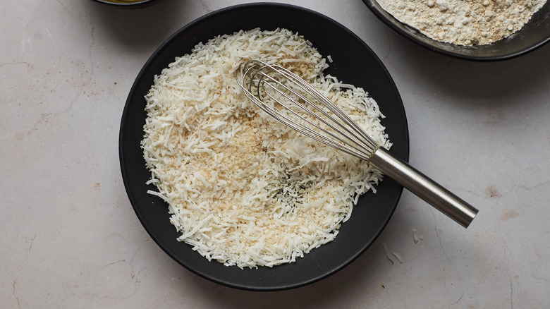 coconut in bowl with whisk 