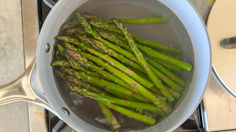 Pot of asparagus in water