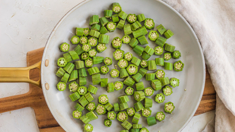 chopped okra in frying pan