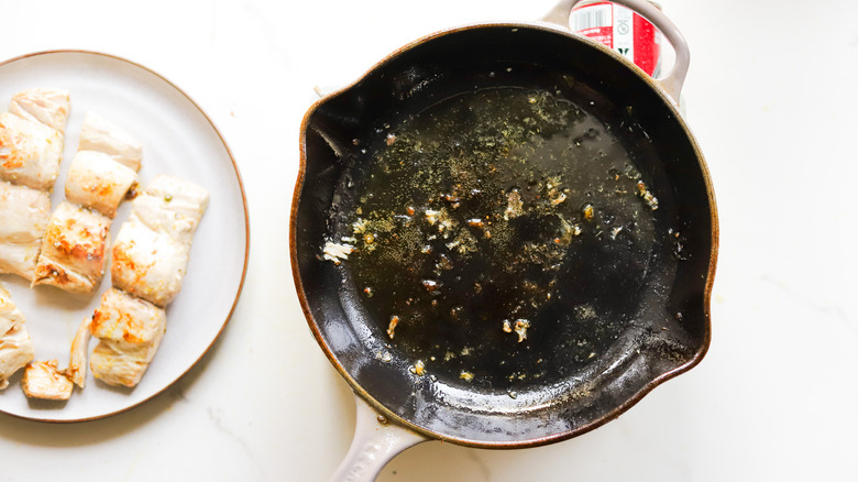 Empty pan with cooked fish