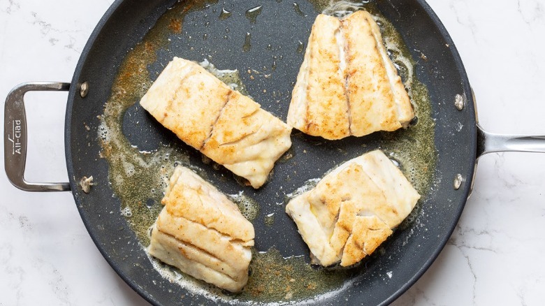 rockfish cooking in pan