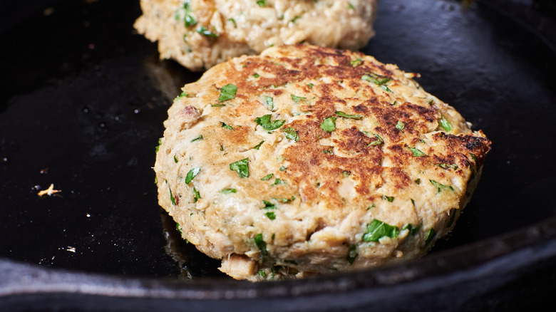 searing burgers in a skillet