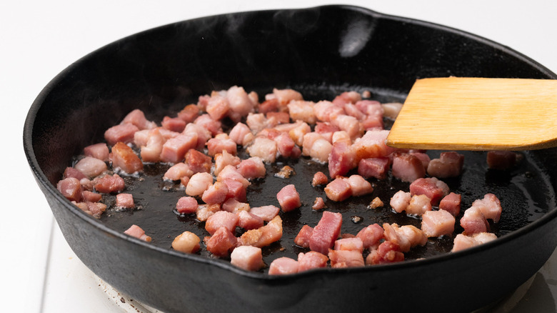 pancetta frying in skillet