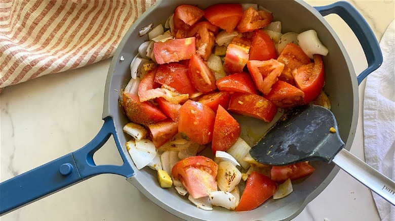 tomato and onions in pan