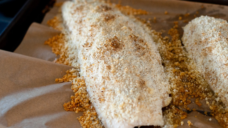 breaded fish on baking dish 