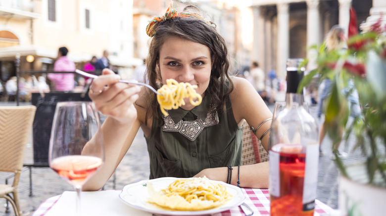 Woman dining in Rome