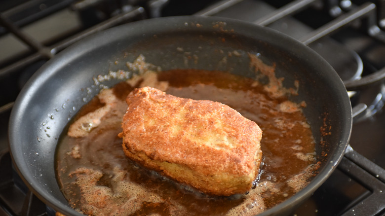 pork chop in frying pan