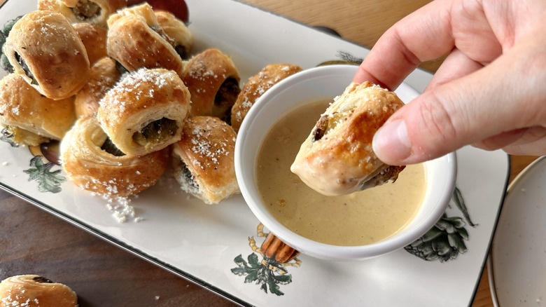 dipping pastry-wrapped brussels sprouts