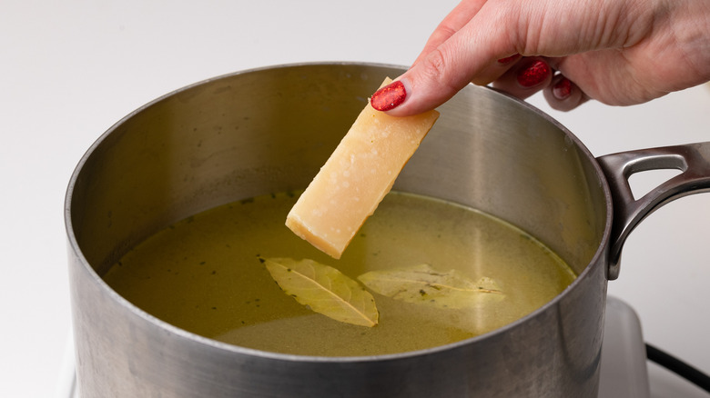 adding parmesan rind to pot