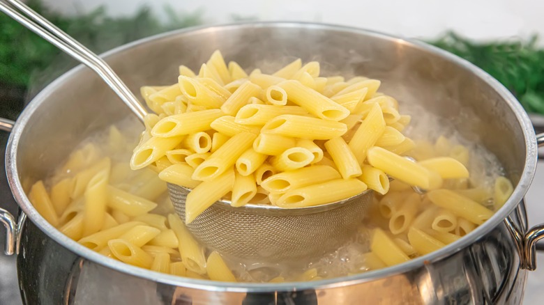 Pasta coming out of pot water