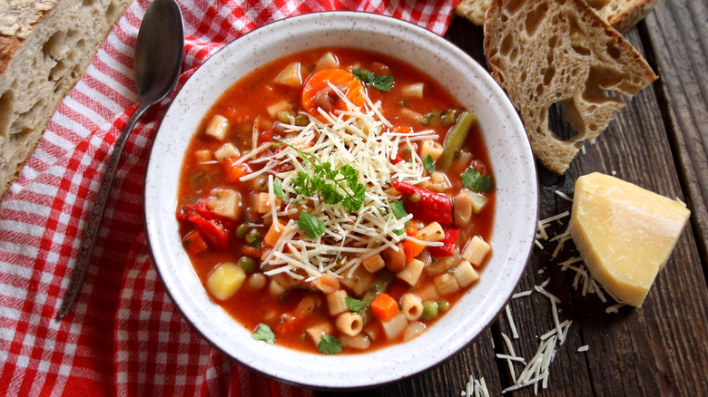 bowl of minestrone soup with grated parmesan