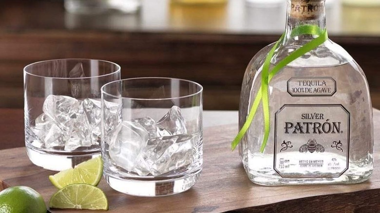 Patrón Silver Tequila bottle and rocks glasses