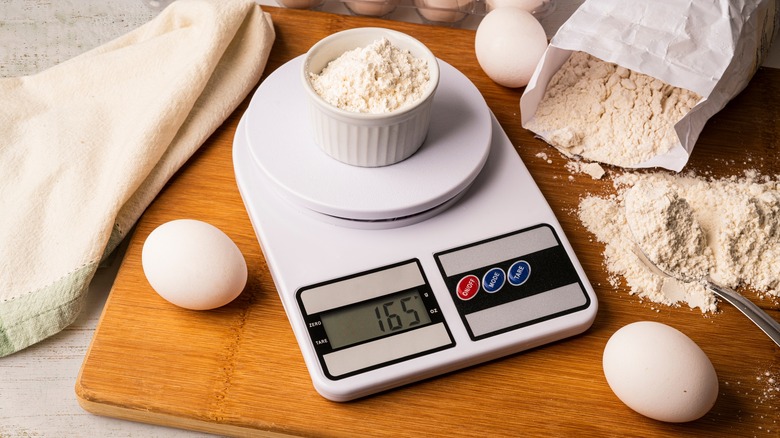 Weighing flour on digital scale