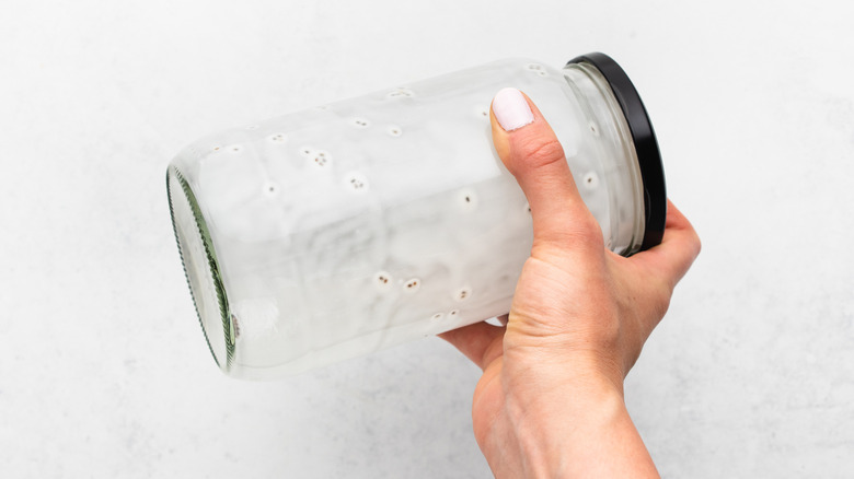 Shaking a jar of chia pudding ingredients