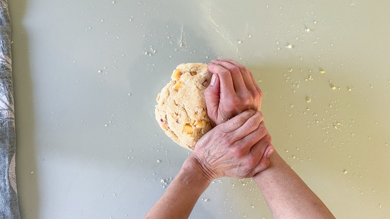 Kneading scone dough on counter top