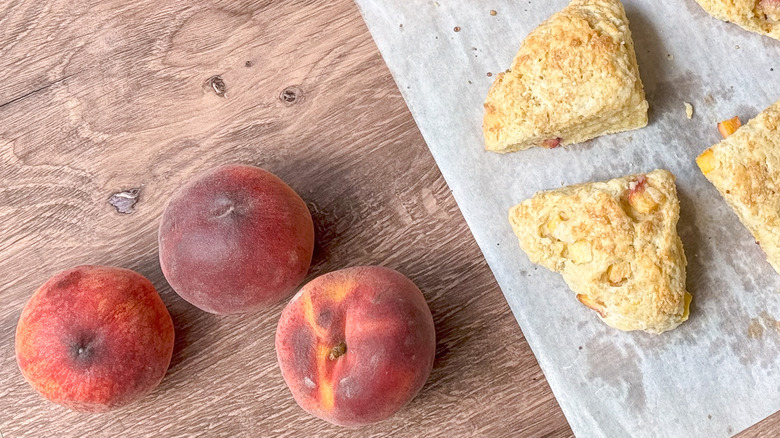Peaches and peach scones on tabletop