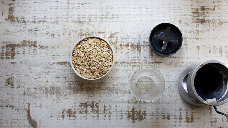 Rolled oats next to blender