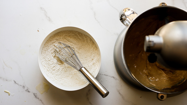 Adding flour mixture to batter