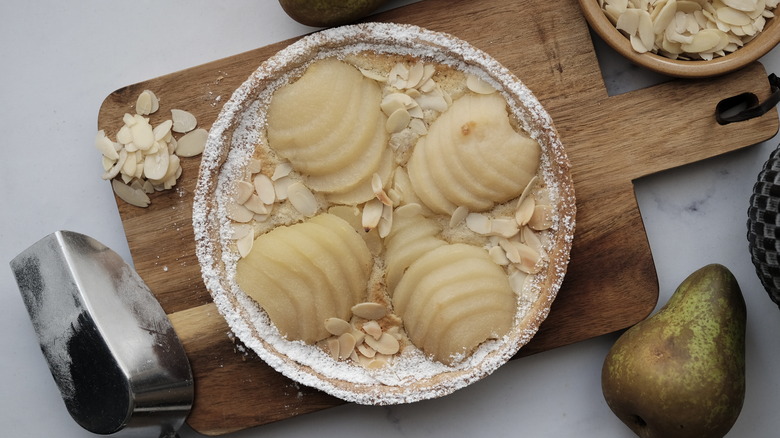 pear almond tart on cutting board