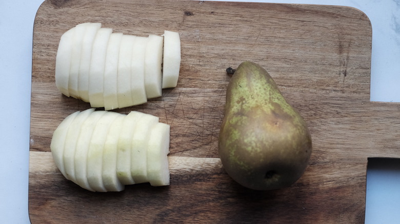 sliced pears on cutting board