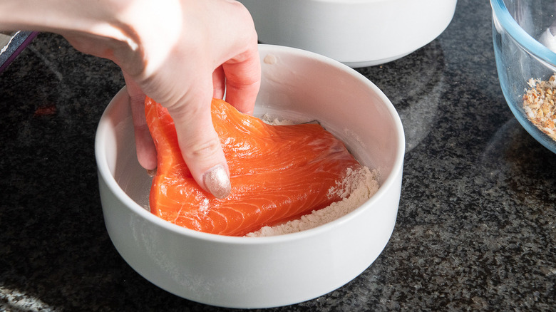 dipping trout fillet in flour