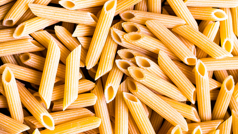 Uncooked penne pasta noodles