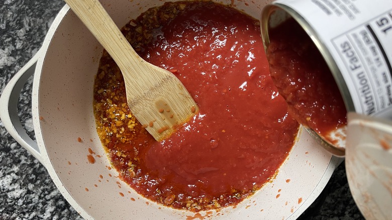 canned tomatoes in pan