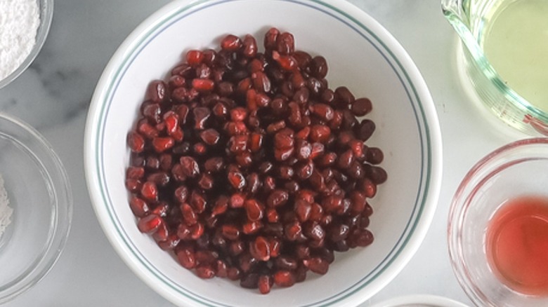 pomegranate arils in white bowl