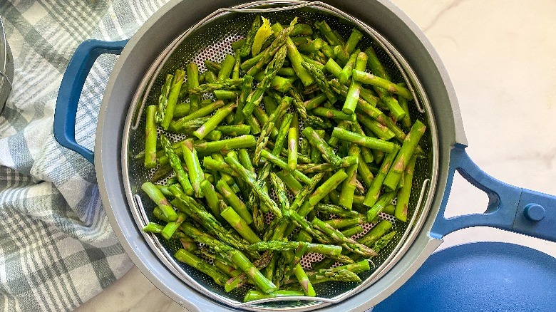 cut asparagus in steamer basket