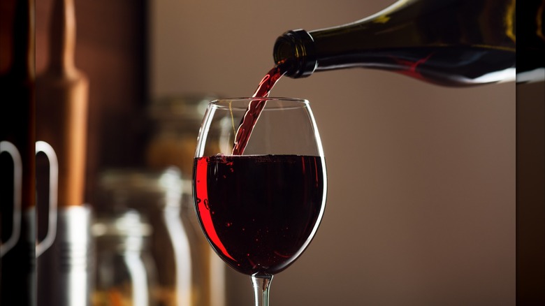 Red wine being poured into a glass