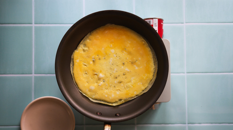 Scrambled eggs cooking in pan